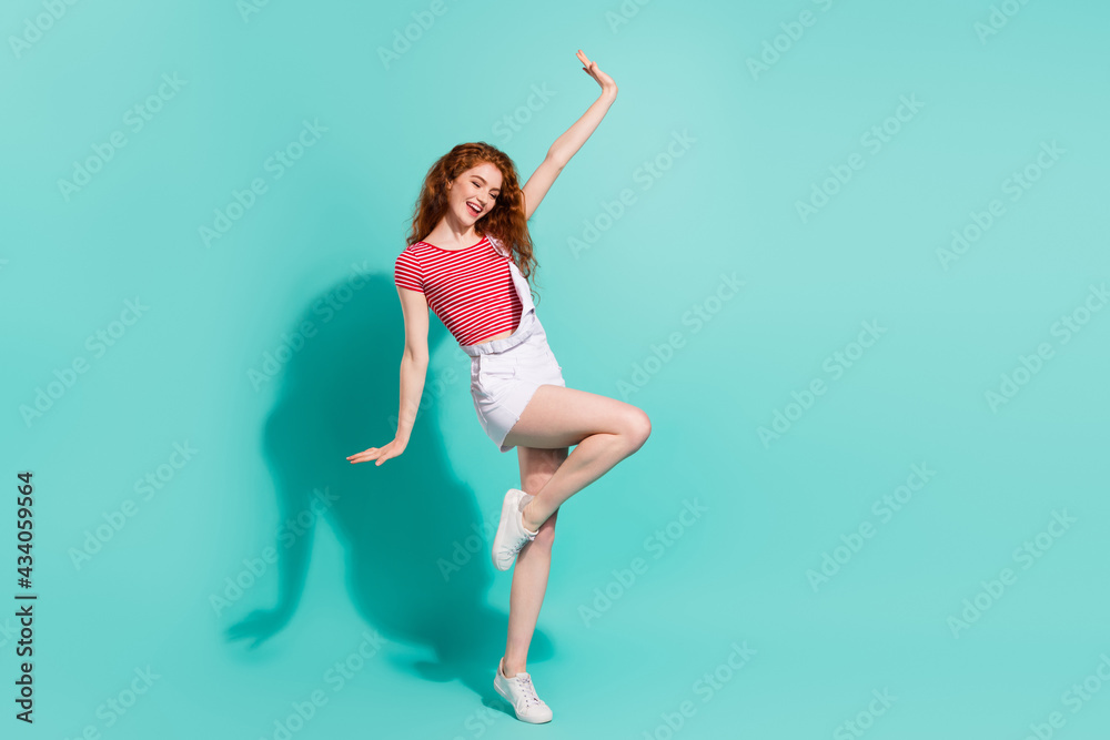 Full length body size view of dreamy lovely cheerful girl dancing having fun relax rest isolated bright blue color background Full length body size view of dreamy lovely cheerful girl dancing having fun relax rest isolated bright blue color background