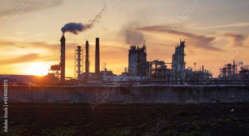 Factory pipe polluting air, smoke from chimneys against sun, environmental problems, ecological theme, industry scene © TTstudio