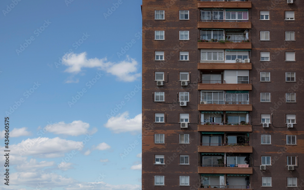 Apartment building with cloud sky, Madrid, Spain.
