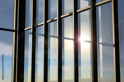Wallpaper Mural Background of modern exterior design and architecture of glass window building with reflection of blue sky, clouds and sunlight in the evening time. Torontodigital.ca