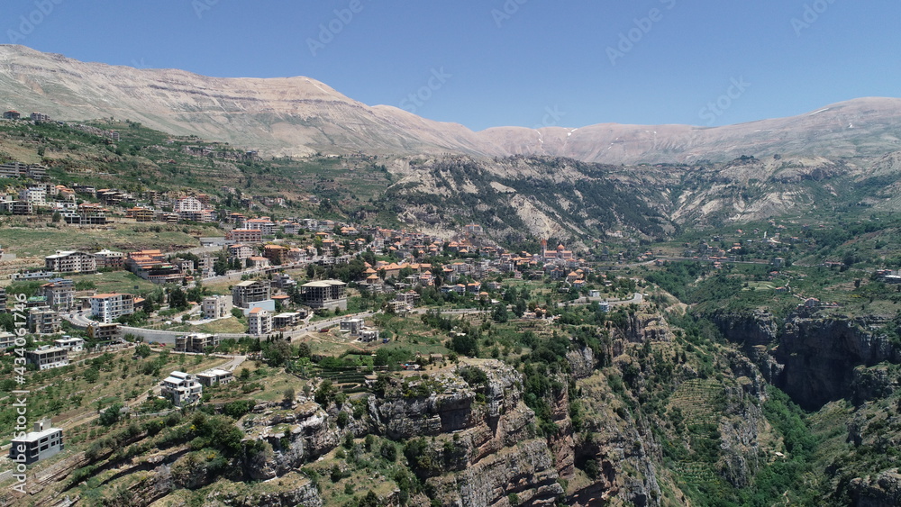 Best hiking trails. Middle East country. Summer vacation in Lebanon. Road trip. Mountains from bird's eye view. View from the top of the mountains. Houses