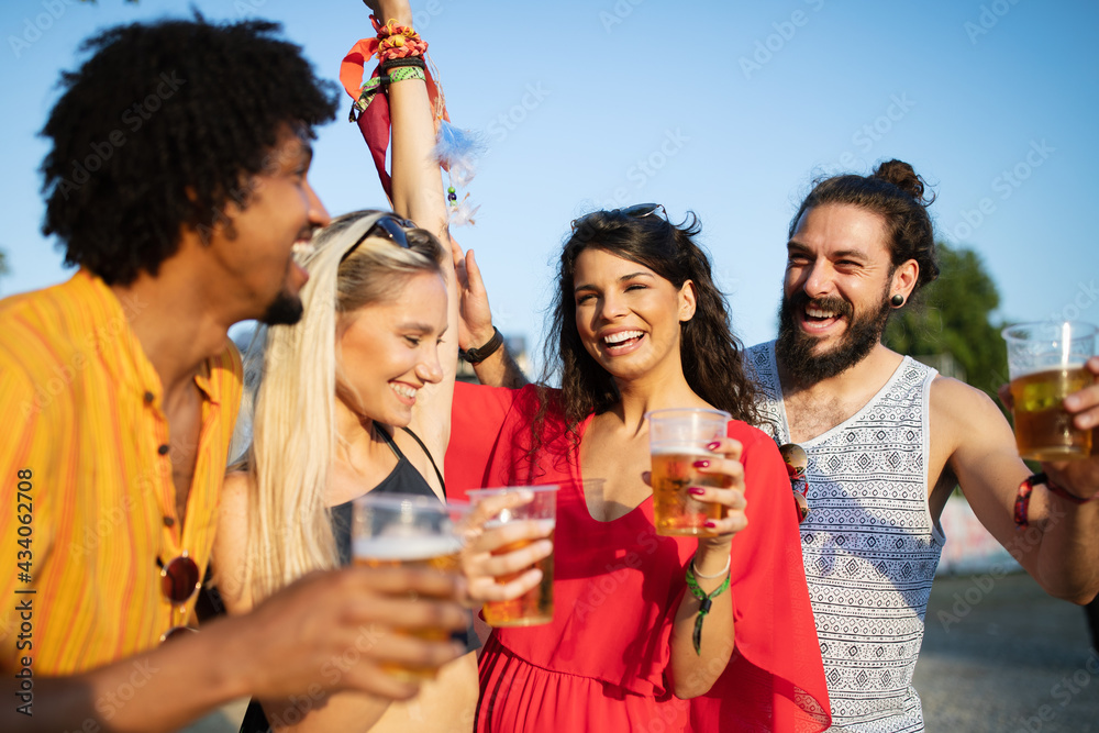 Happy friends laughing and having fun outdoors Happy friends laughing and having fun outdoors