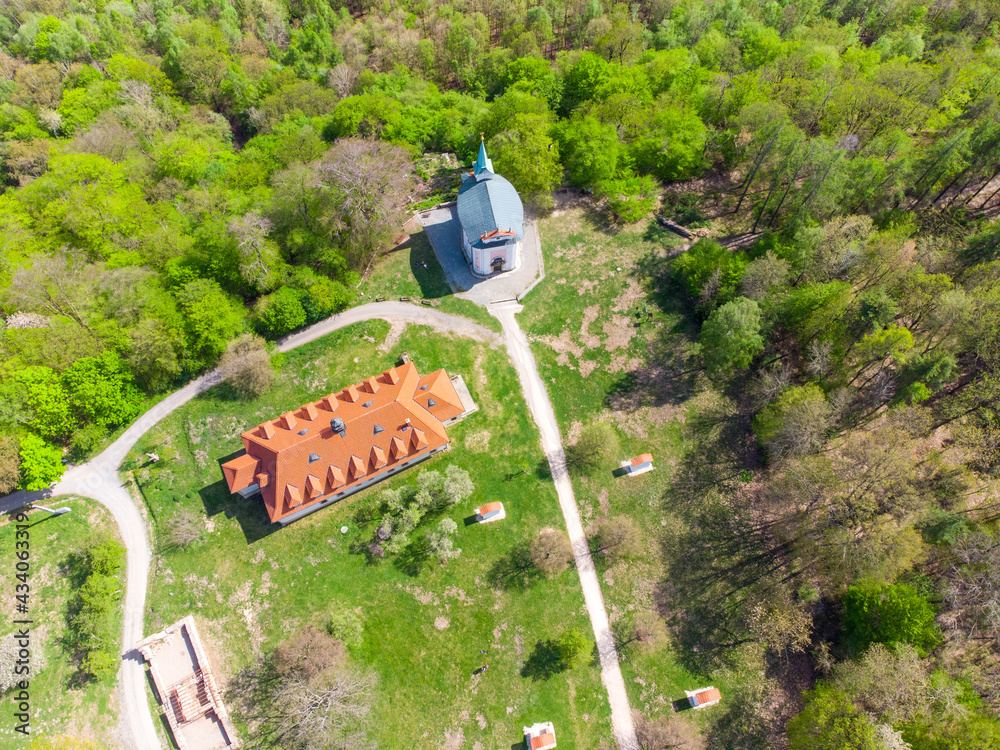 Fototapeta premium Skalka Baroque complex with church of St Mary Magdalene and Stations of the Cross. Mnisek pod Brdy, Czech Republic. Aerial view from drone.