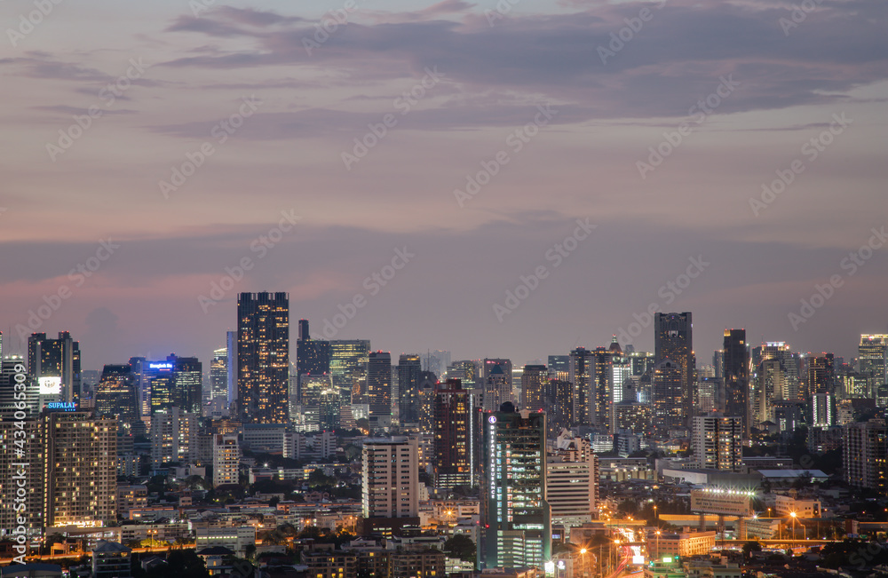 Bangkok, Thailand - May 09, 2021: Aerial view of Beautiful scenery view of Skyscraper Evening time Sunset creates relaxing feeling for the rest of the day. Selective focus.