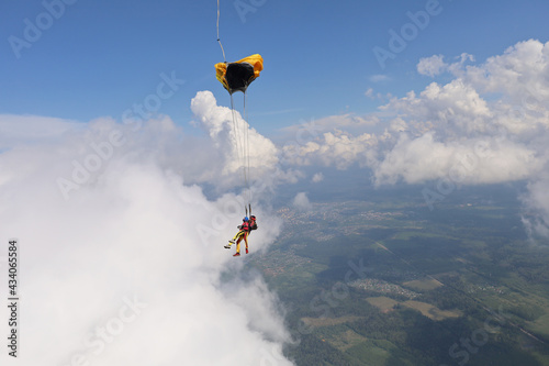 Skydiving. A parachute. Amazing clouds.