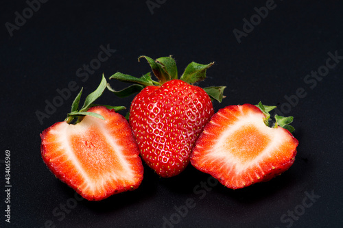 Juicy strawberries cut in half.
