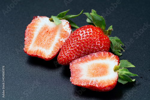 Juicy large strawberries in two halves.