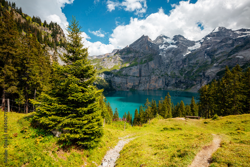Spectacular view of the lake Oeschinensee in sunny day. Location place Swiss alps, Kandersteg district, Europe.