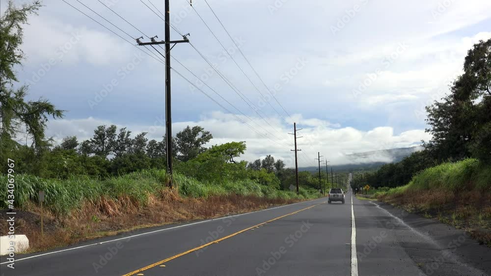 Road traffic at Mamalahoa Highway (Hawaii Belt Road). Big Island, Hawaii, USA Road traffic at Mamalahoa Highway (Hawaii Belt Road). Big Island, Hawaii, USA