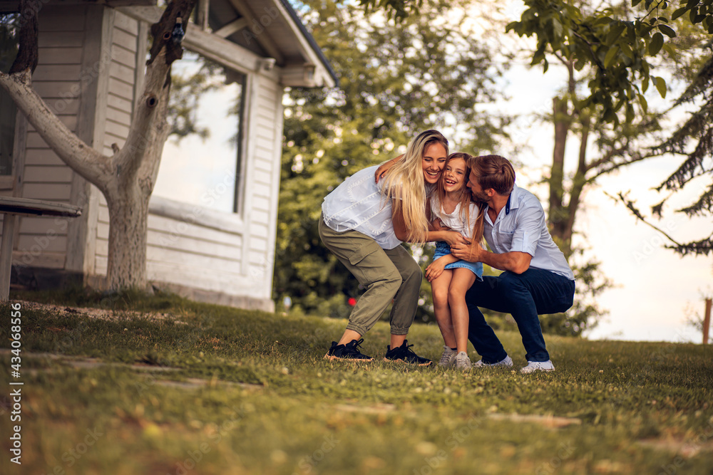 Happy family in backyard. Happy family in backyard.