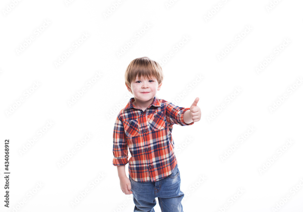Little boy in plaid shirt thumb up isolated Little boy in plaid shirt thumb up isolated