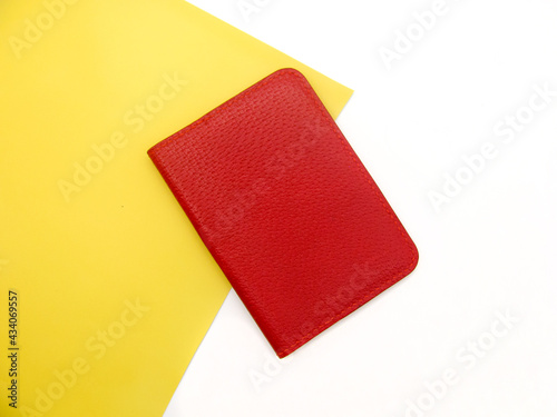 The cover is red leather for the passport on a yellow and white background.