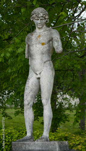 Statue of a young Greek or Roman man, naked, with broken arms