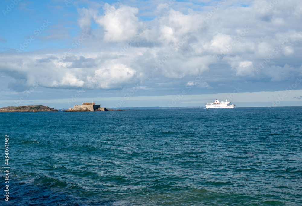  Passenger ferry leaving the port of Saint Malo in the morning in the direction of United Kingdom