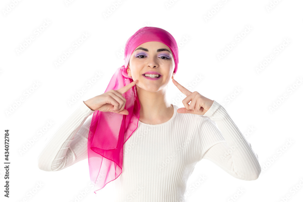 Young brunette woman wearing pink head scarf Young brunette woman wearing pink head scarf