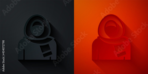 Paper cut Muslim woman in hijab icon isolated on black and red background. Paper art style. Vector