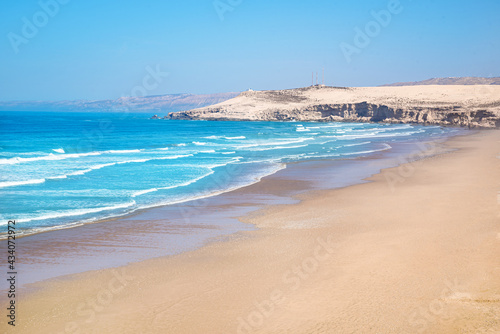 Moroccan beach with fresh hot sand in the summertime on the coast of Morocco in Africa © cristianbalate
