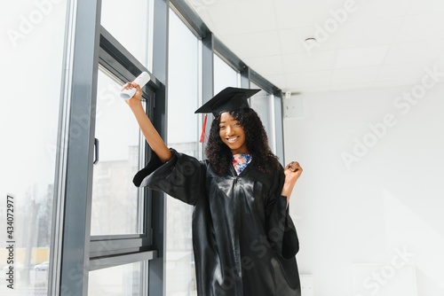 Excited African American woman at her graduation.
