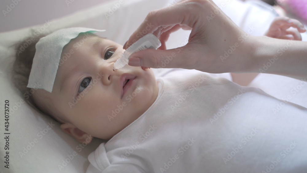 infant-nose-snot-removal-by-picking-baby-infant-nasal-saline-drop