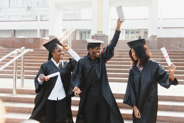 optimistic young university graduates at graduation