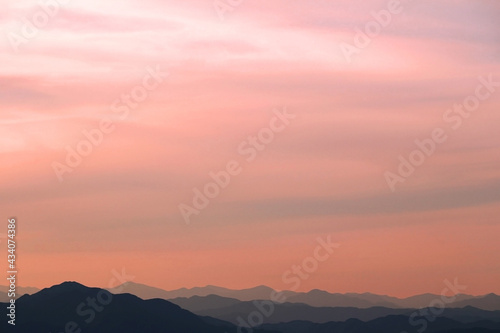 Sunset sky and silhouette mountains