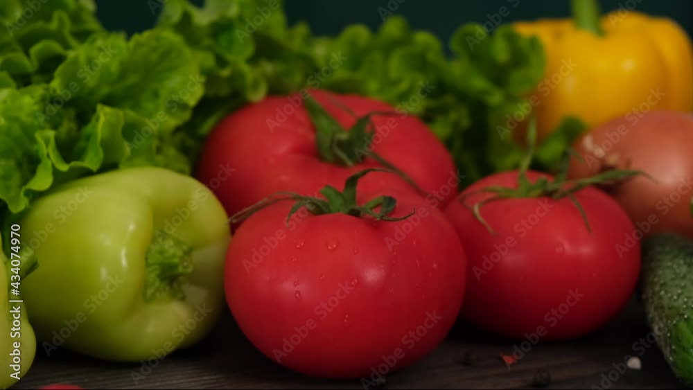 Composition with assorted raw organic vegetables on a dark background. Detox diet. Composition with assorted raw organic vegetables on a dark background. Detox diet.