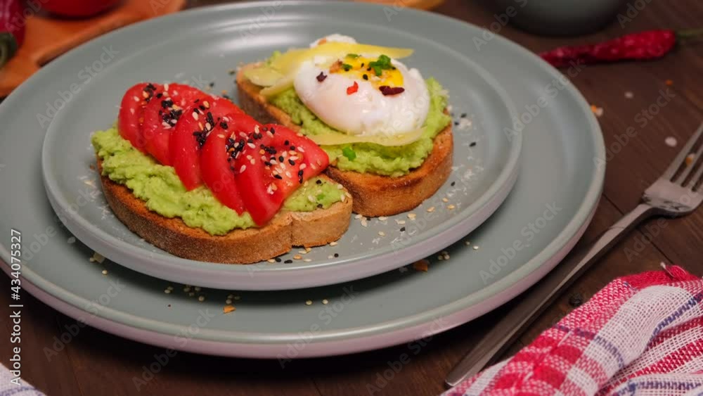 bruschetta with avocado and tomato and poached egg, delicious breakfast served bruschetta with avocado and tomato and poached egg, delicious breakfast served