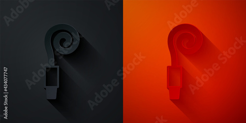 Paper cut Birthday party horn icon isolated on black and red background. Paper art style. Vector