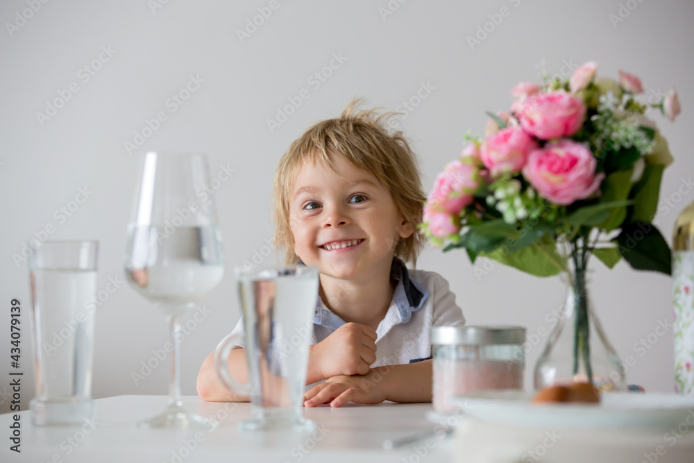 Sweet toddler boy, drinking water at home Sweet toddler boy, drinking water at home