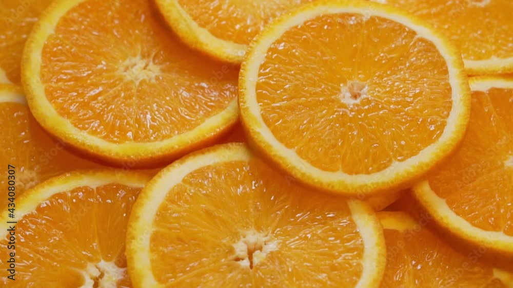 Slices Of Citrus Oranges, Tropical Fruits. Sliced Slices Of Ripe Oranges. Fresh Crop. Vitamin-Rich Healthy Vegan Food and Diet. Abstract Background of Orange Slices.