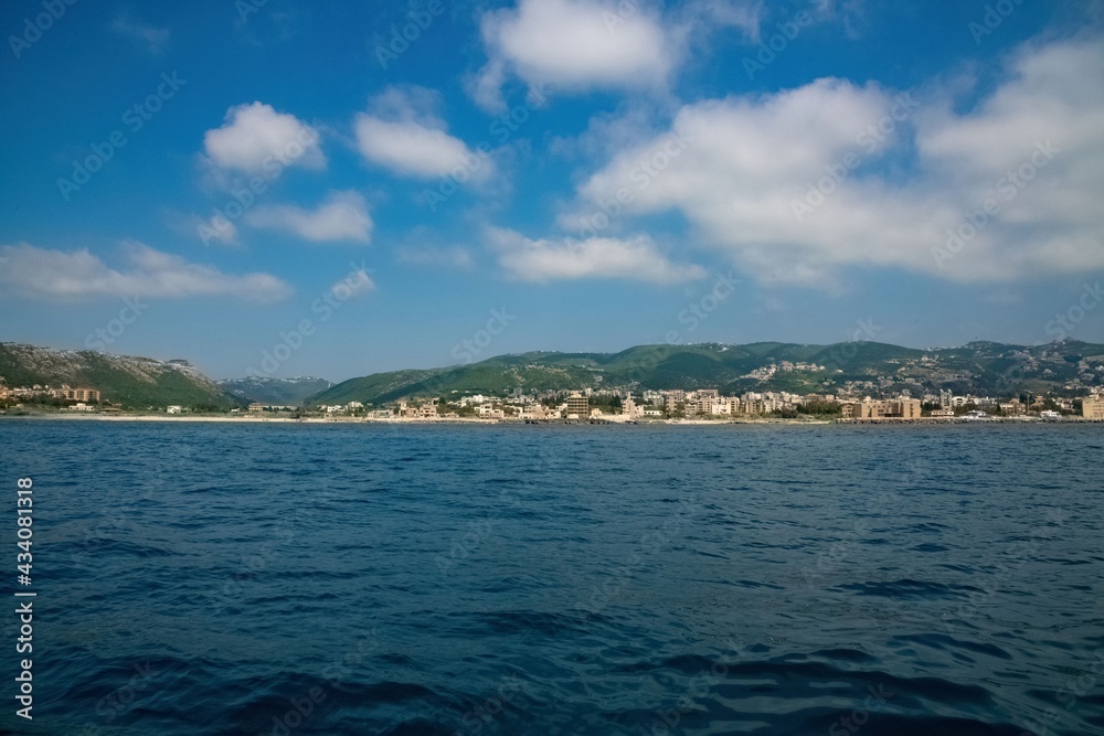 Lebanon city of Batroun viewed from the sea in a distance Lebanon city of Batroun viewed from the sea in a distance