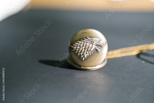 Pocket watch with a wolf head design closeup. Selective Focus. High quality photo
