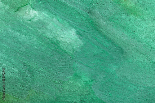 Watercolor emerald rough textured background. uneven malachite stone surface.