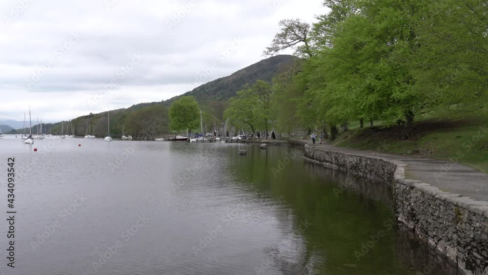 Footpath Windermere The Lake District England uk people walking in good spring weather Footpath Windermere The Lake District England uk people walking in good spring weather