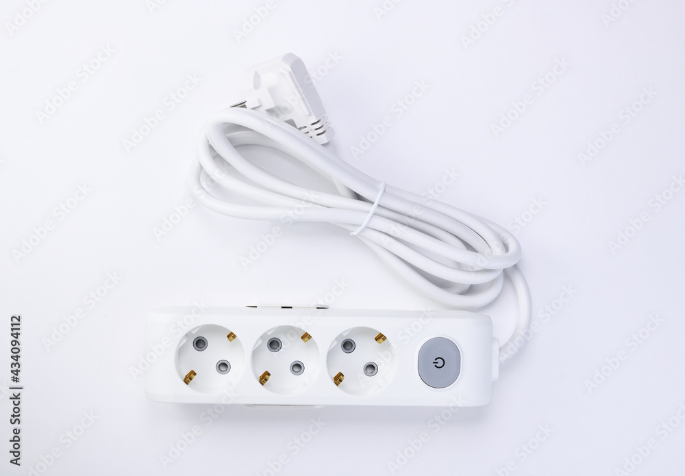 White extension cord with three outlets. Power strip with switch for home or office. White extension cord with three outlets. Power strip with switch for home or office.