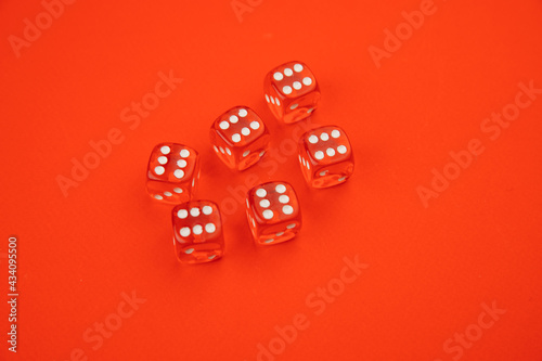 Six game dices isolated on red