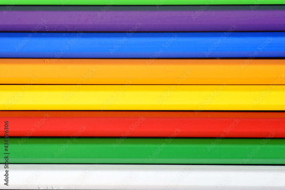 Top down view of color pencils arranged in parallel. Top down view of color pencils arranged in parallel.