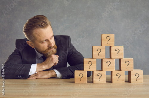 Obraz na plátne Serious thoughtful puzzled confused undecided clever intelligent young business