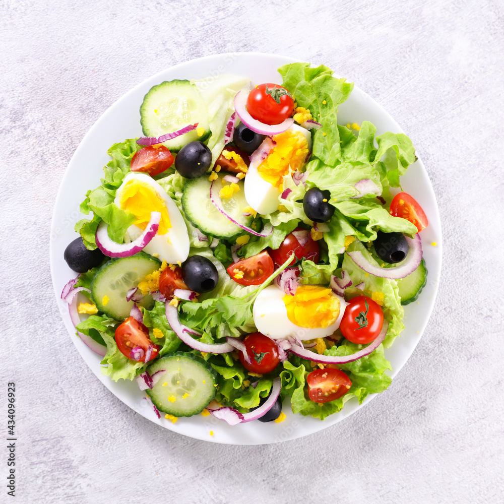 vegetable salad with cucumber,  egg and tomato