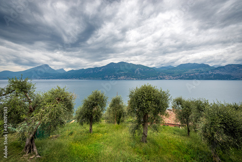 Lago di Garda. Elevated view of the Lake Garda with the Lombardy and Veneto coastline, From the small village of Castelletto di Brenzone, Brenzone sul Garda, Verona province, Italy, southern Europe. photo