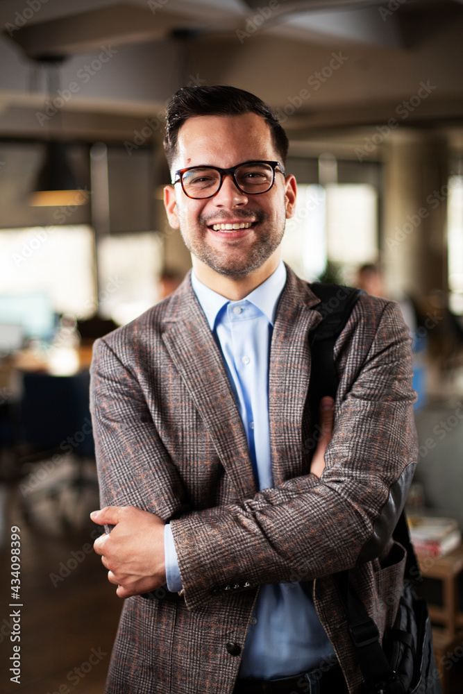Fototapeta premium Portrait of handsome businessman. Young man working in the office