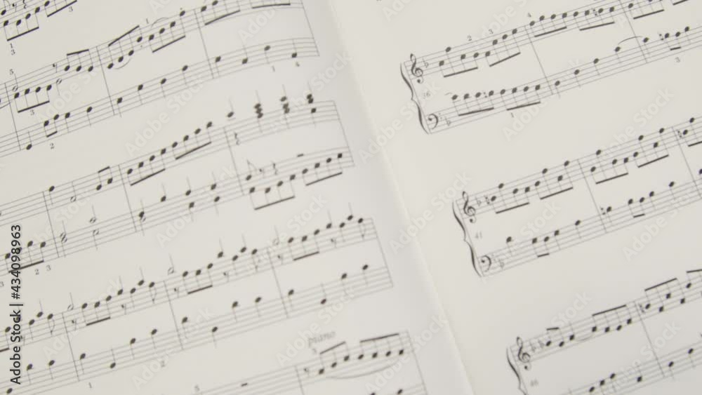Tracking Shot Pulling Away from Music Sheet Book Tracking Shot Pulling Away from Music Sheet Book