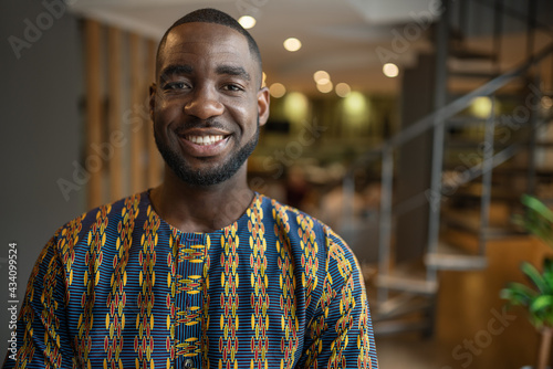 Portrait smiling black african businessman wearing traditional clothing