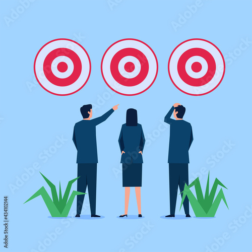 Business man and woman choose between three target