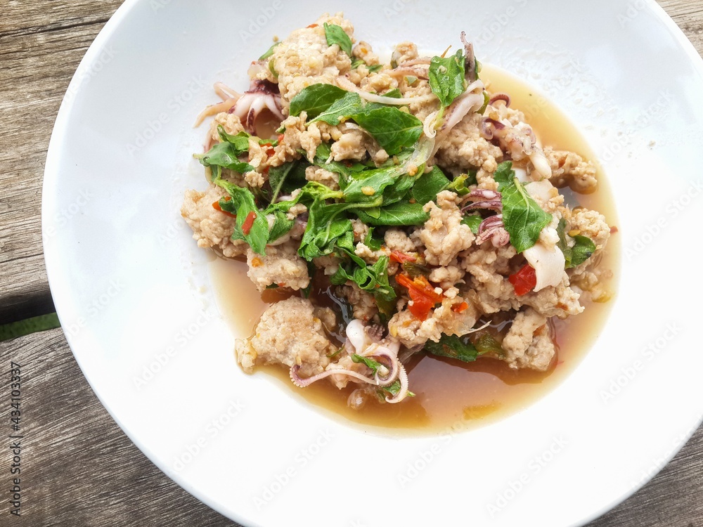 spicy pork basil and squid fried - Thailand style food spicy pork basil and squid fried - Thailand style food