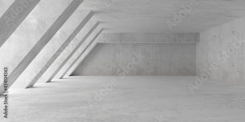 Abstract empty, modern concrete room with soft light from left with diagonal pillars and rough floor - industrial interior background template