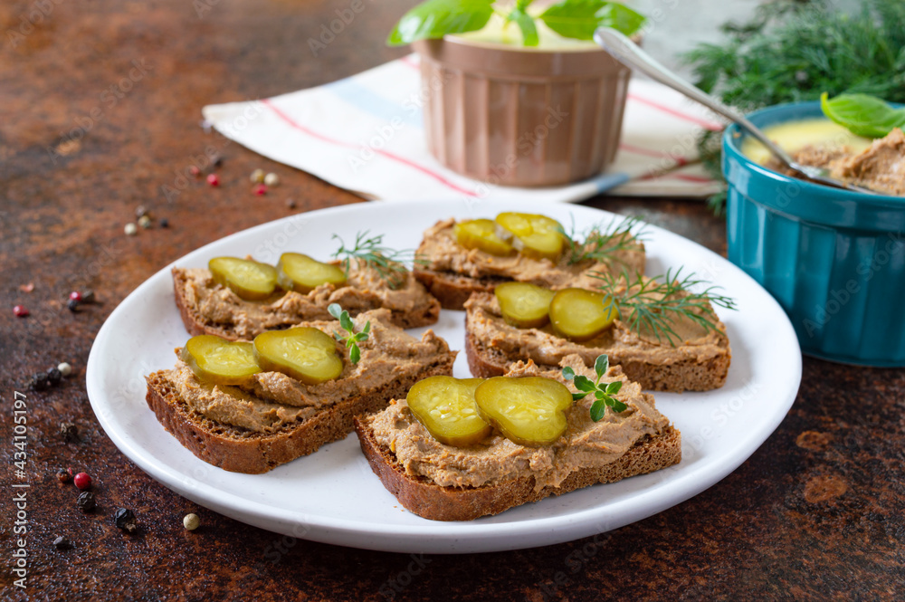 Rye bread with turkey liver pate and pickled cucumbers. Delicious appetizer. Rye bread with turkey liver pate and pickled cucumbers. Delicious appetizer.