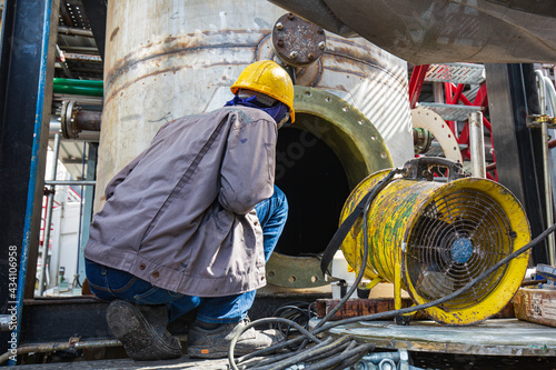 Male into the tank oil area confined space photo