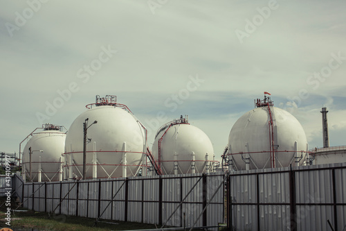 White spherical propane tanks containing fuel gas pipeline