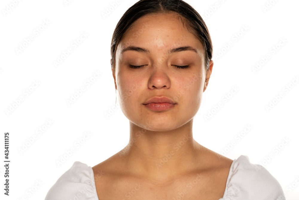 portrait of a young beautiful woman with tight black hair and closed eyes portrait of a young beautiful woman with tight black hair and closed eyes